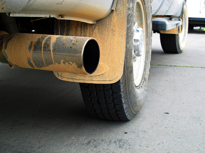 Tailpipe of yellow diesel truck